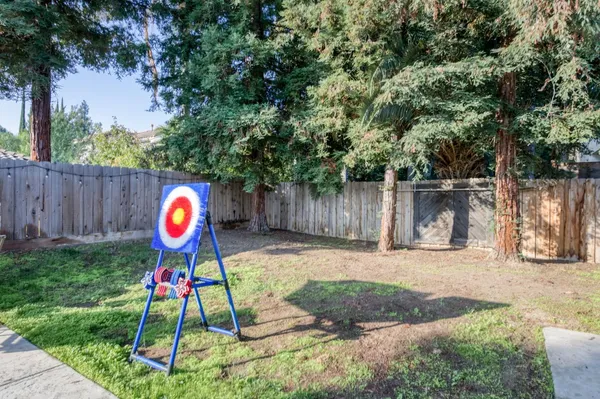 a view of outdoor space with garden and swing
