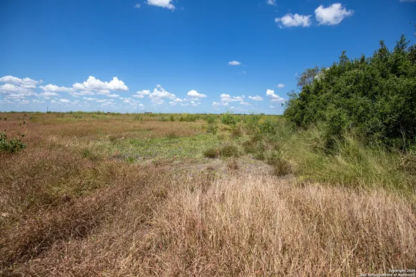 a view of an ocean and a yard