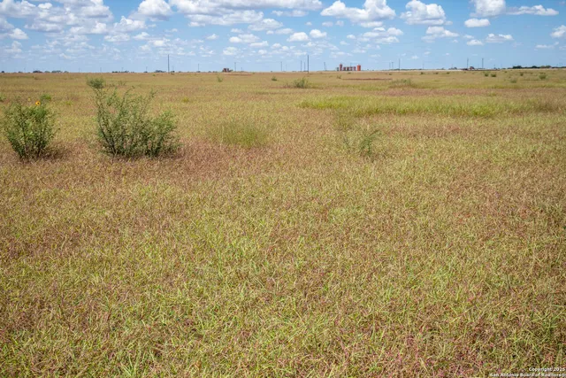 a view of an ocean and a yard