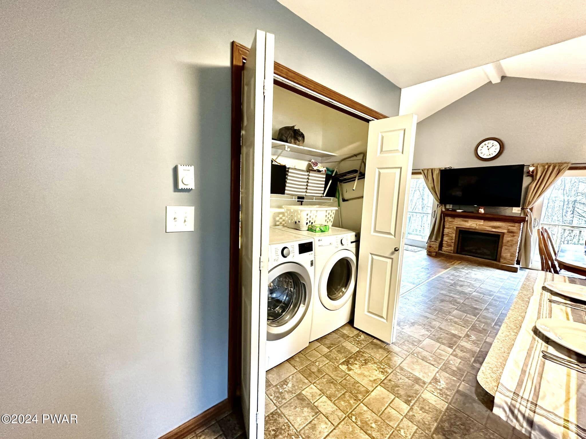 210 Fox Road Dingmans Ferry, PA 18328 - Photo 15 of 38 a view of a kitchen with a sink washer and dryer
