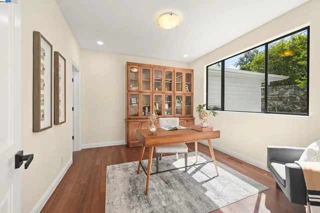 a workspace with furniture and a window