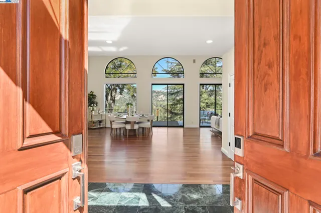 a view of living room with fireplace furniture and floor to ceiling window