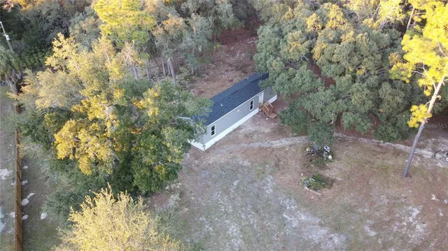 a view of a yard with a tree