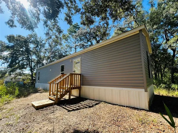 a view of a porch with a yard