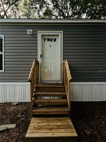 a view of backyard with wooden floor and a window