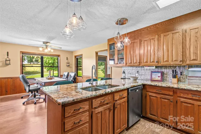 a kitchen with a sink stove and microwave