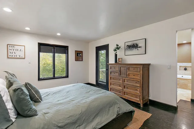 a bedroom with a bed and a dresser