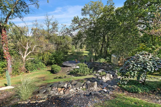 a backyard of a house with lots of green space