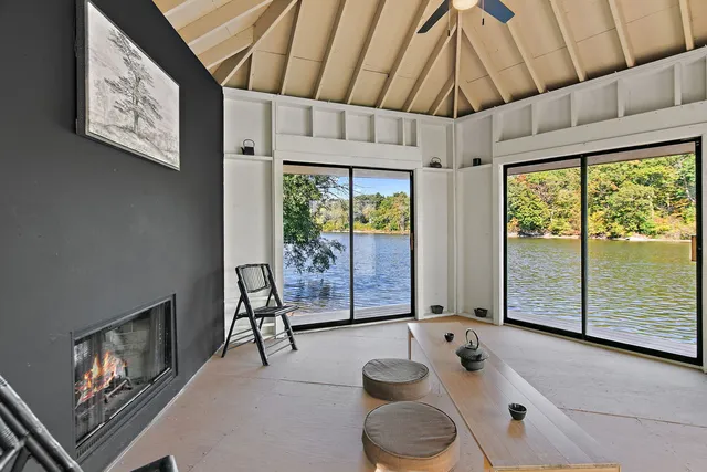 a backyard of a house with a yard and outdoor seating