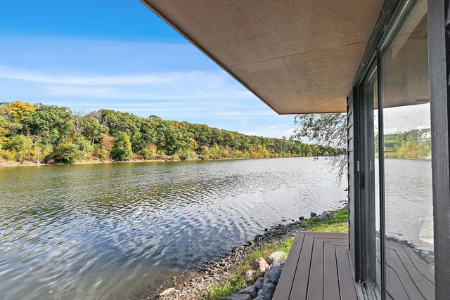 a view of a green field with lots of bushes