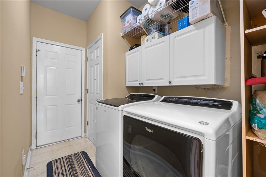 8935 Mountain Ridge Circle Ball Ground, GA 30107 - Photo 23 of 56 a utility room with dryer and washer