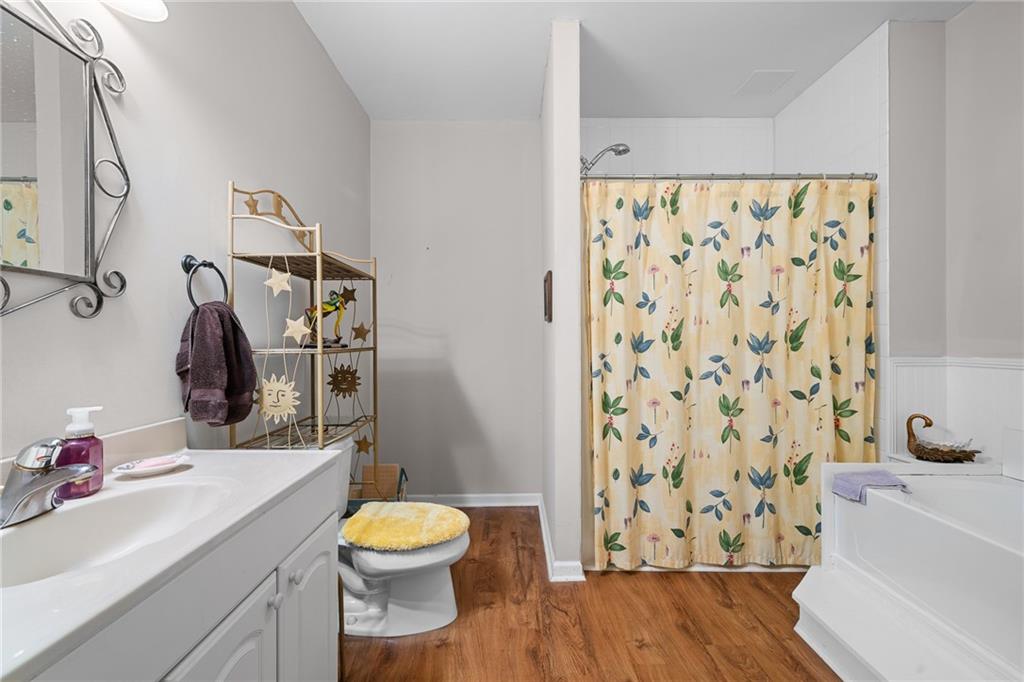 8935 Mountain Ridge Circle Ball Ground, GA 30107 - Photo 31 of 56 a bathroom with a sink toilet and shower