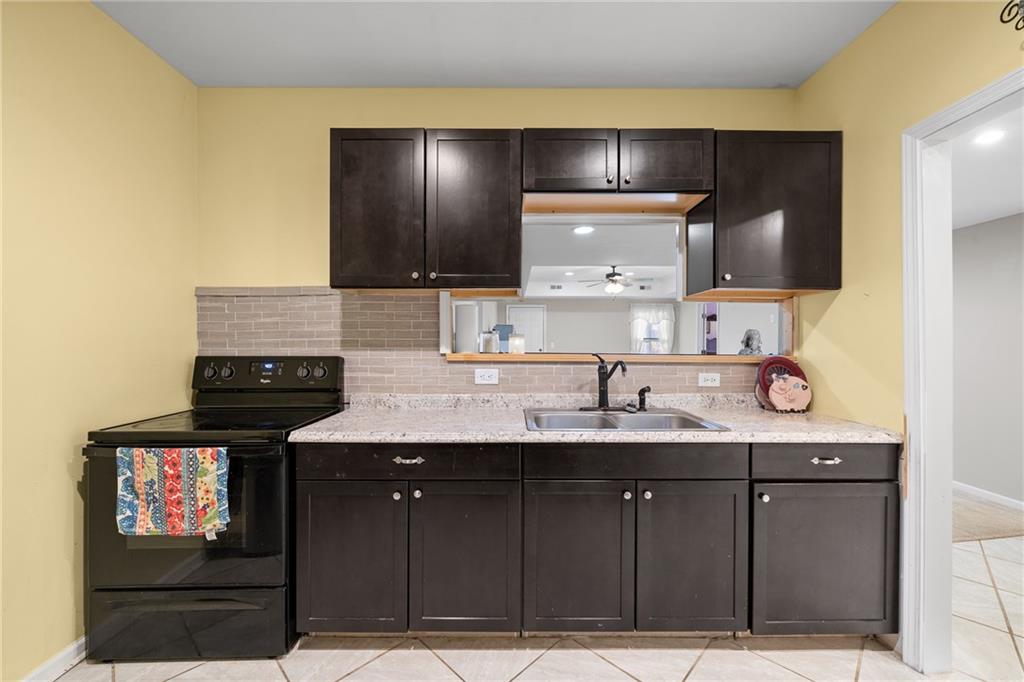 8935 Mountain Ridge Circle Ball Ground, GA 30107 - Photo 33 of 56 a bathroom with a sink and a mirror