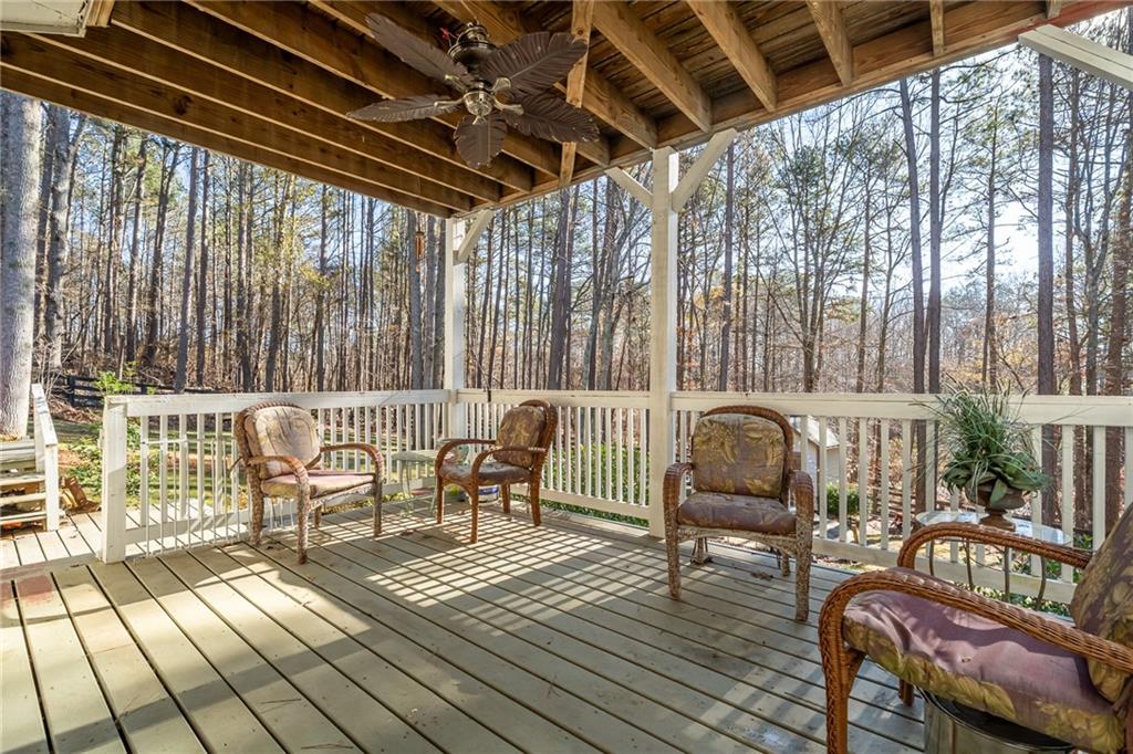 8935 Mountain Ridge Circle Ball Ground, GA 30107 - Photo 37 of 56 a balcony with wooden floor outdoor seating