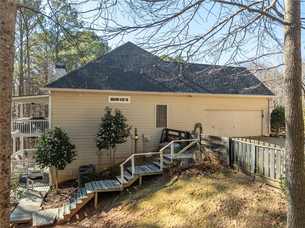 8935 Mountain Ridge Circle Ball Ground, GA 30107 - Photo 38 of 56 a view of a house with yard and sitting area