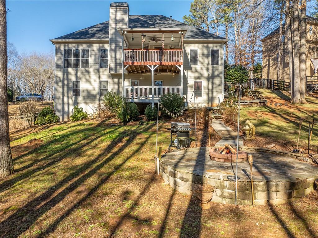 8935 Mountain Ridge Circle Ball Ground, GA 30107 - Photo 43 of 56 a view of a brick building with many windows