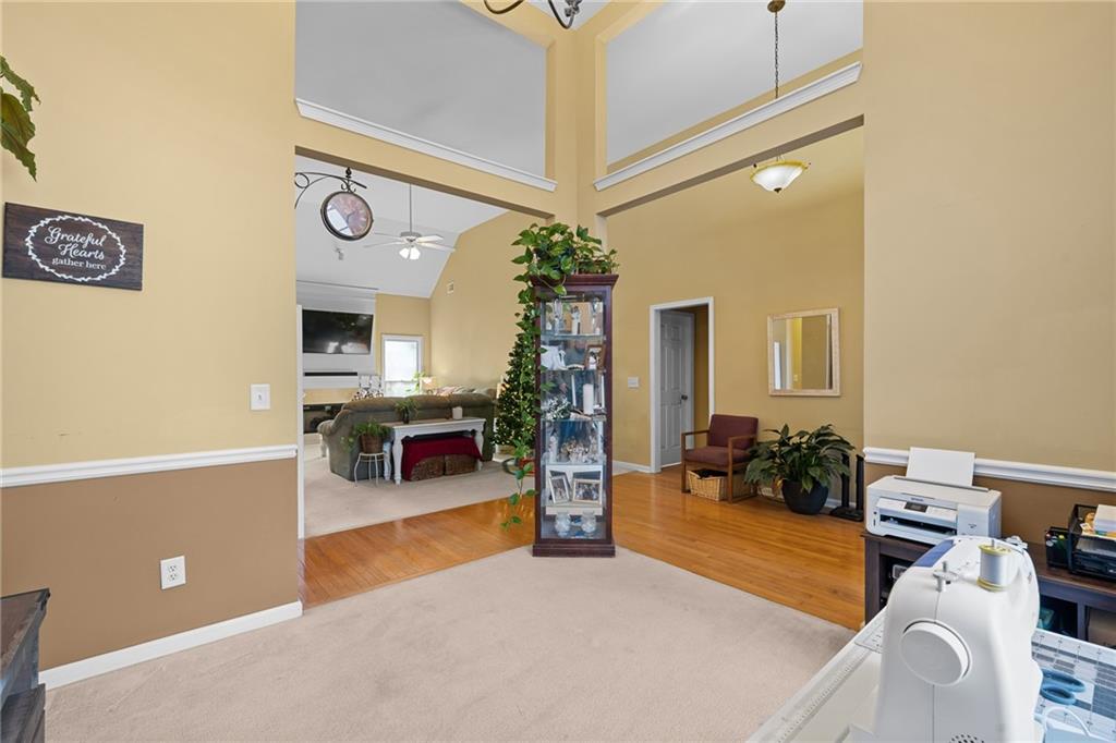 8935 Mountain Ridge Circle Ball Ground, GA 30107 - Photo 7 of 56 a living room with furniture and a flat screen tv