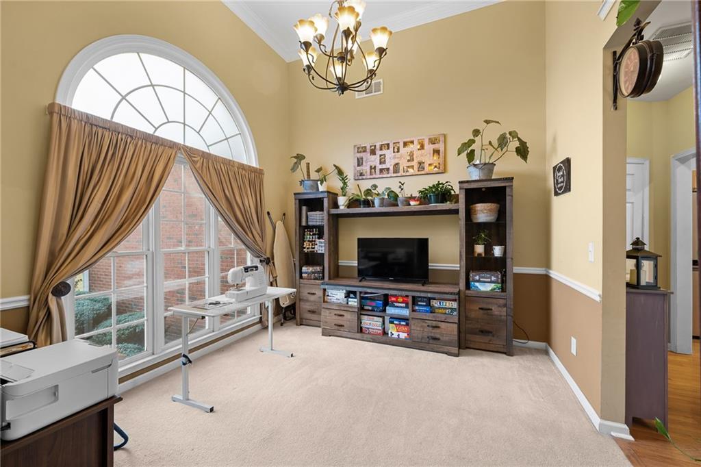 8935 Mountain Ridge Circle Ball Ground, GA 30107 - Photo 8 of 56 a view of hall way with furniture and chandelier