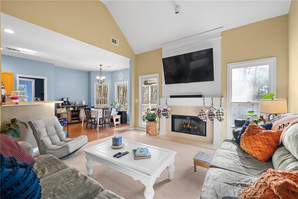 8935 Mountain Ridge Circle Ball Ground, GA 30107 - Photo 9 of 56 a living room with furniture fireplace and flat screen tv