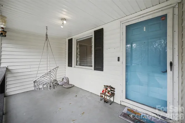a bathroom with a window and a shower