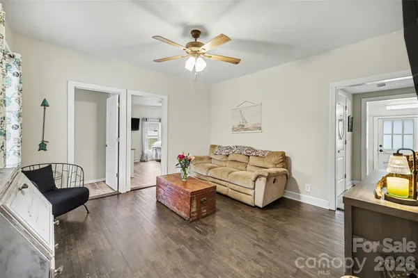 a bedroom with furniture and wooden floor