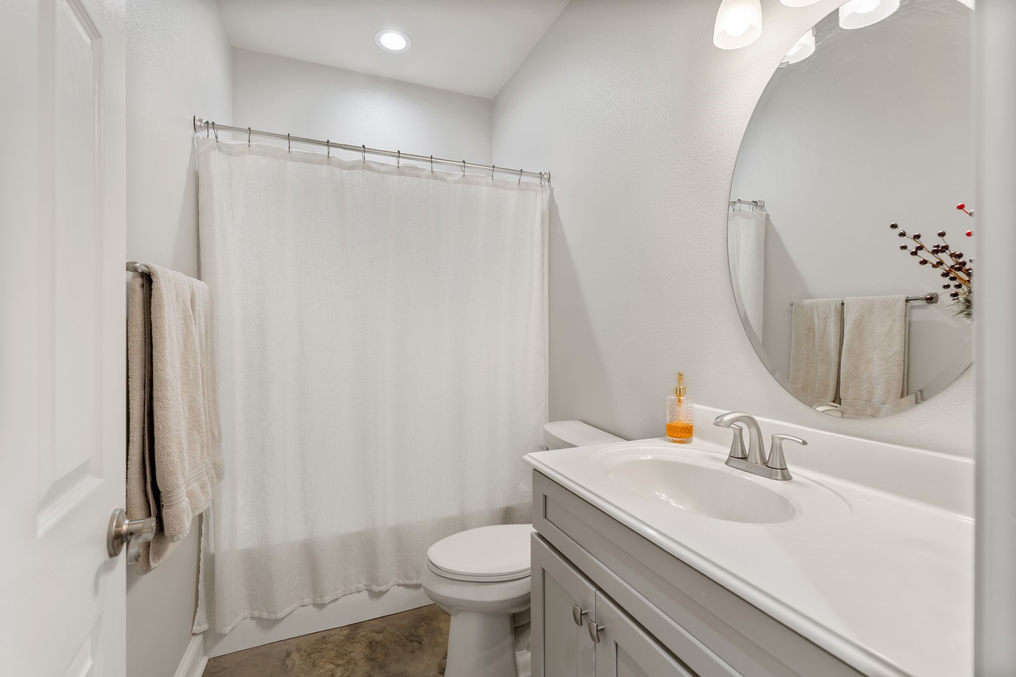 413 East Spruce Street Huntington, TX 75949 - Photo 12 of 37 a bathroom with a sink toilet and shower