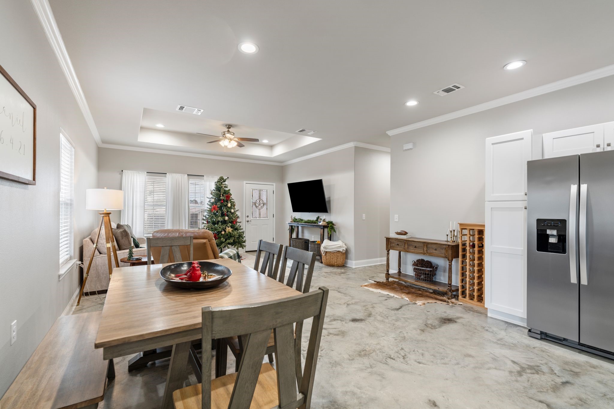 413 East Spruce Street Huntington, TX 75949 - Photo 26 of 37 a living room with furniture a flat screen tv and a refrigerator