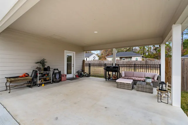 a view of a house with a yard and sitting area