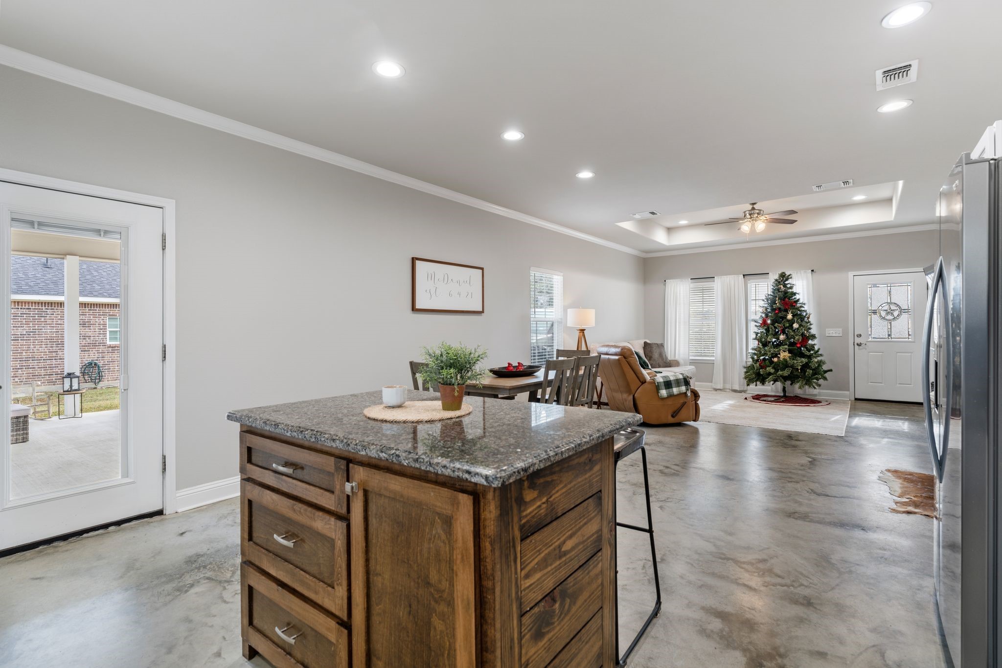 413 East Spruce Street Huntington, TX 75949 - Photo 4 of 37 a view of kitchen island kitchen island granite countertop living room