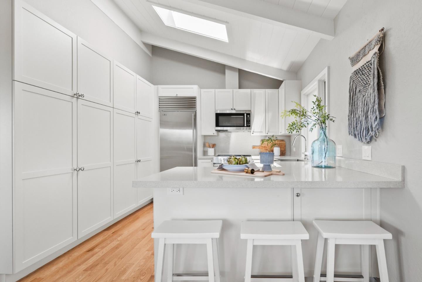 1975 Seascape Boulevard Aptos, CA 95003 - Photo 19 of 63 a kitchen with cabinets and stainless steel appliances