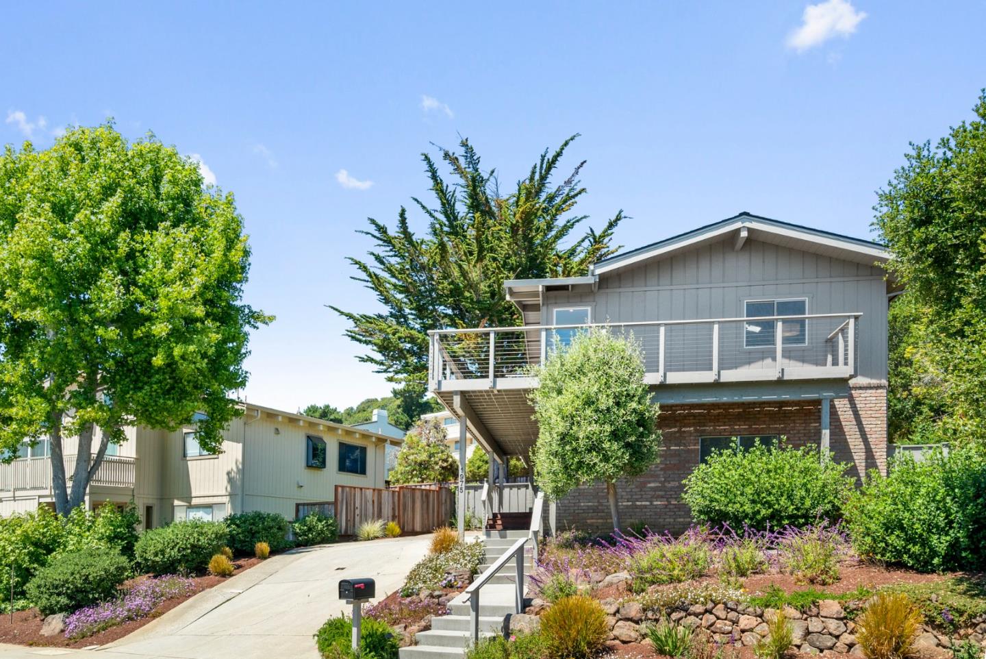 1975 Seascape Boulevard Aptos, CA 95003 - Photo 5 of 63 a front view of a house with a yard