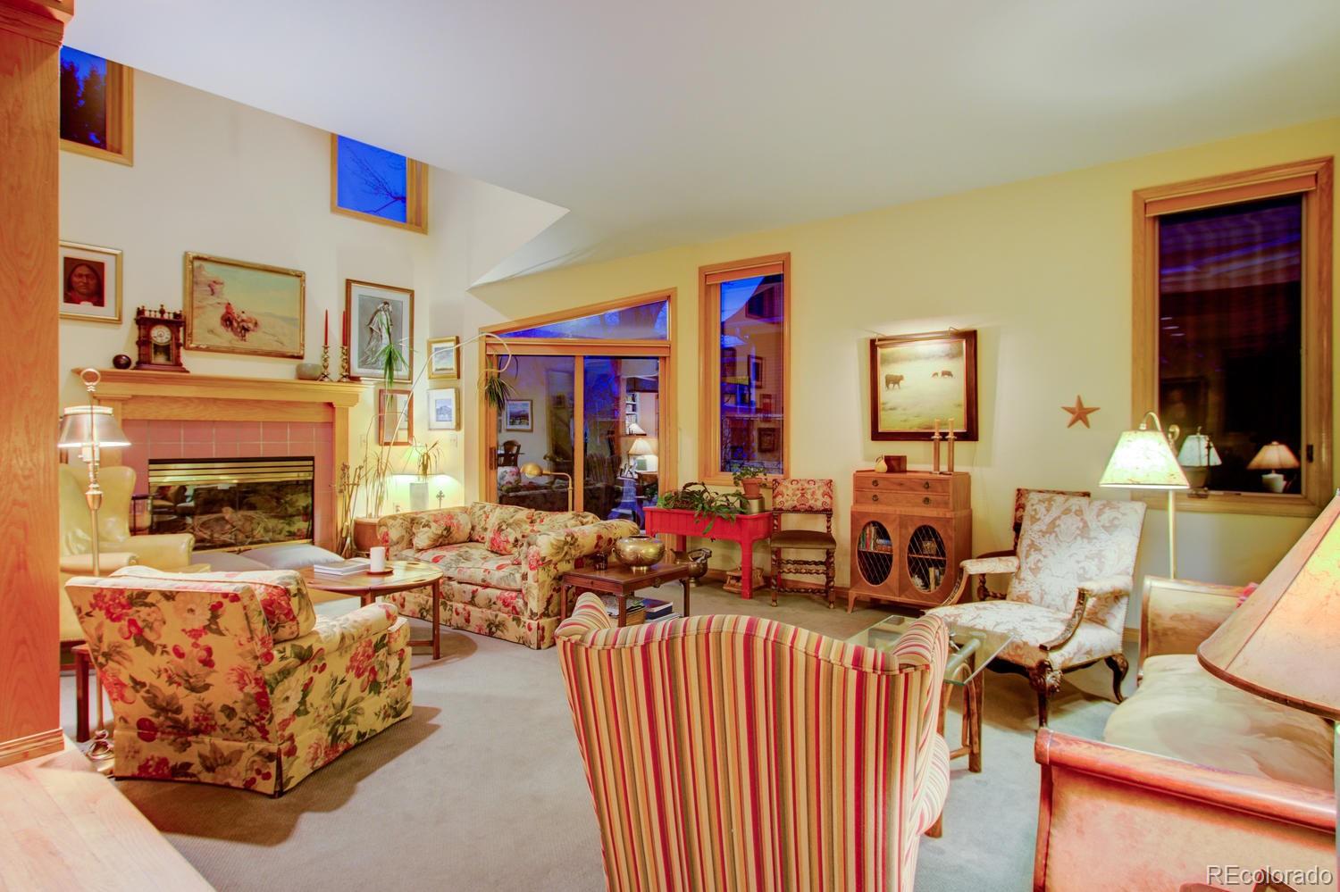 2313 Mapleton Avenue Boulder, CO 80304 - Photo 13 of 35 a living room with furniture fireplace and a flat screen tv