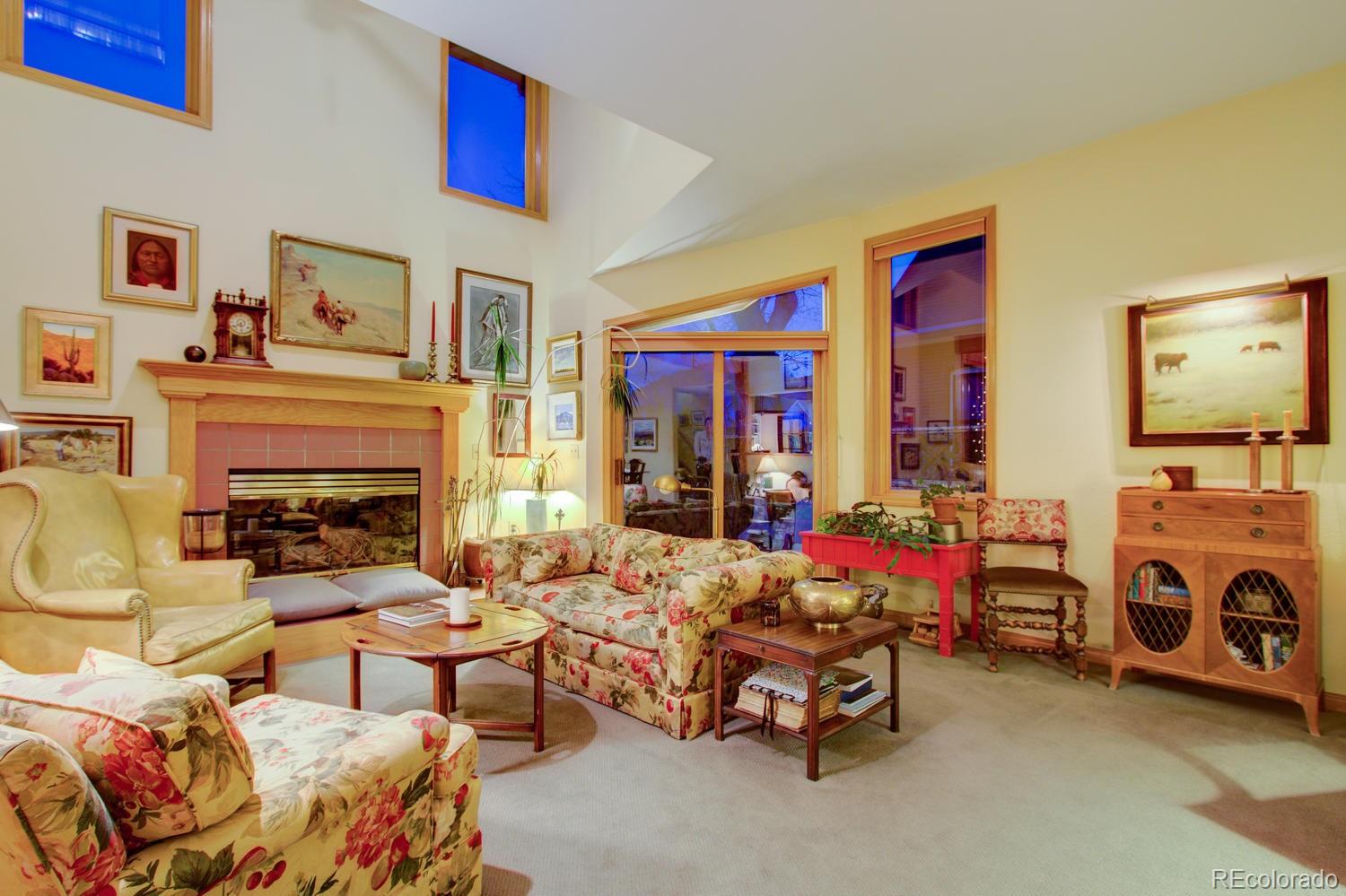 2313 Mapleton Avenue Boulder, CO 80304 - Photo 14 of 35 a living room with furniture gym equipment and a fireplace