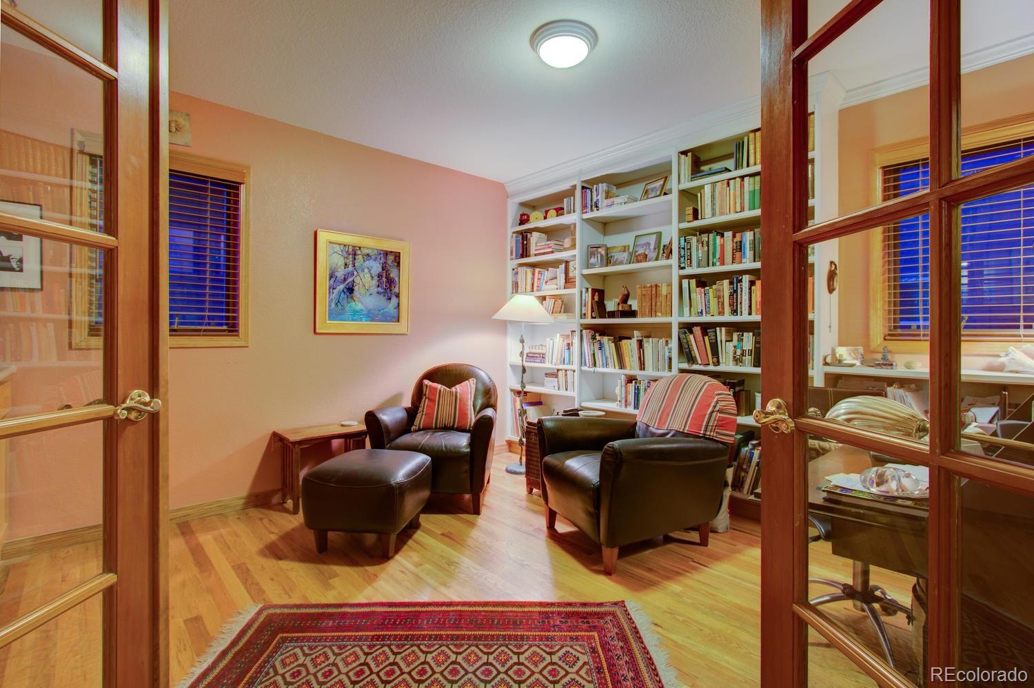 2313 Mapleton Avenue Boulder, CO 80304 - Photo 20 of 35 a living room with furniture a bookshelf and a window