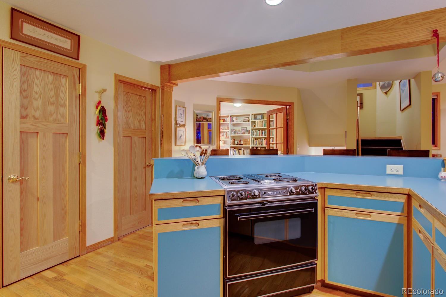2313 Mapleton Avenue Boulder, CO 80304 - Photo 24 of 35 a kitchen with stainless steel appliances granite countertop a stove and a refrigerator