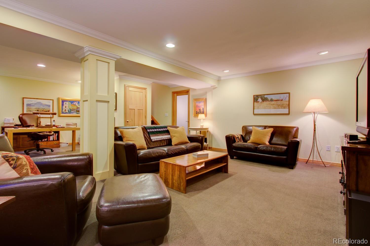2313 Mapleton Avenue Boulder, CO 80304 - Photo 27 of 35 a living room with furniture and a lamp