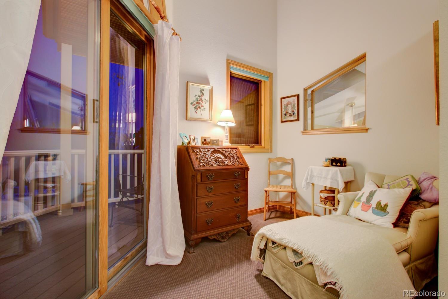 2313 Mapleton Avenue Boulder, CO 80304 - Photo 33 of 35 a bedroom with furniture and a lamp