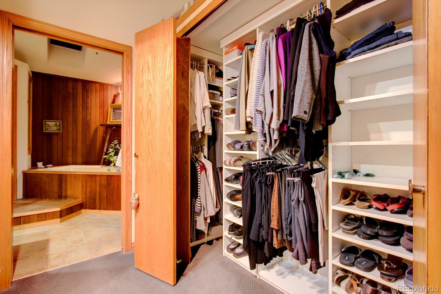 2313 Mapleton Avenue Boulder, CO 80304 - Photo 35 of 35 a view of walk in closet with clothes and shoes