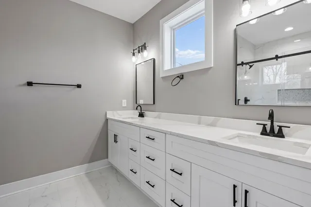 a bathroom with a sink and a mirror