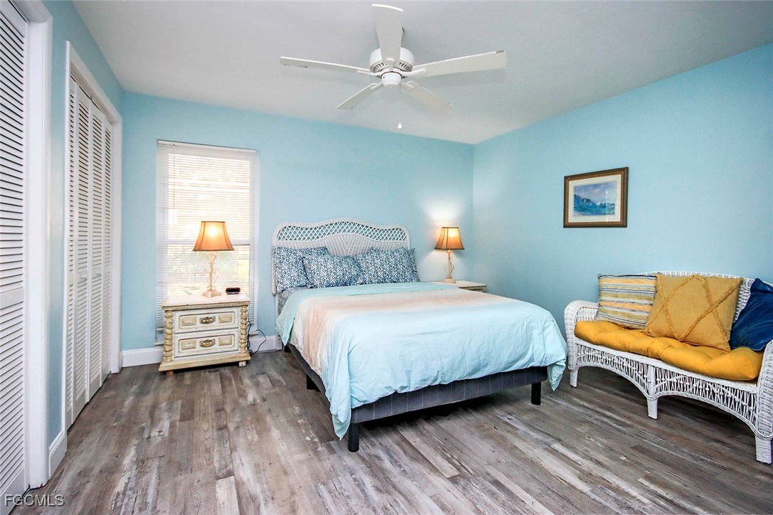 4560 Brainard Bayou Road Sanibel, FL 33957 - Photo 16 of 32 a bedroom with a bed and a couch