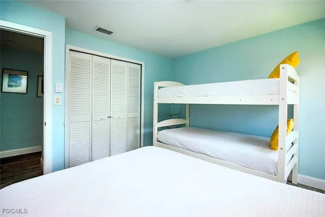 a bedroom with a bed and a cabinets