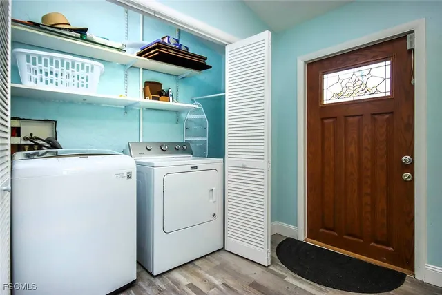 a utility room with dryer and washer