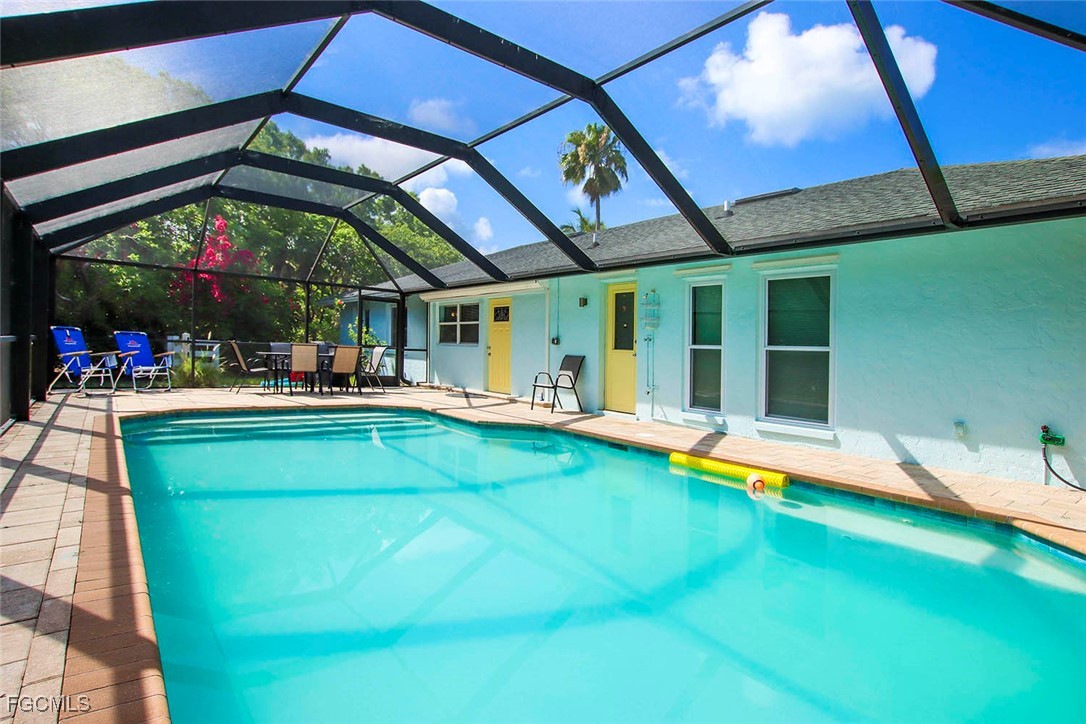 4560 Brainard Bayou Road Sanibel, FL 33957 - Photo 26 of 32 a view of an chairs and table in the patio