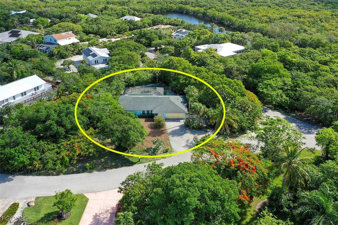 4560 Brainard Bayou Road Sanibel, FL 33957 - Photo 4 of 32 an aerial view of a house