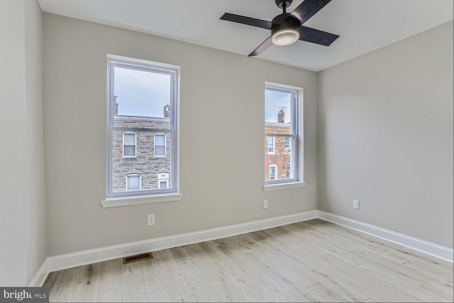 2829 Miles Avenue Baltimore, MD 21211 - Photo 14 of 25 a view of an empty room with a window