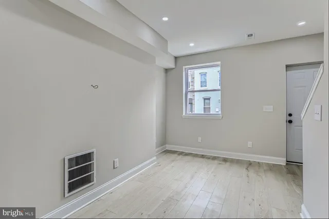 a view of an empty room with a window