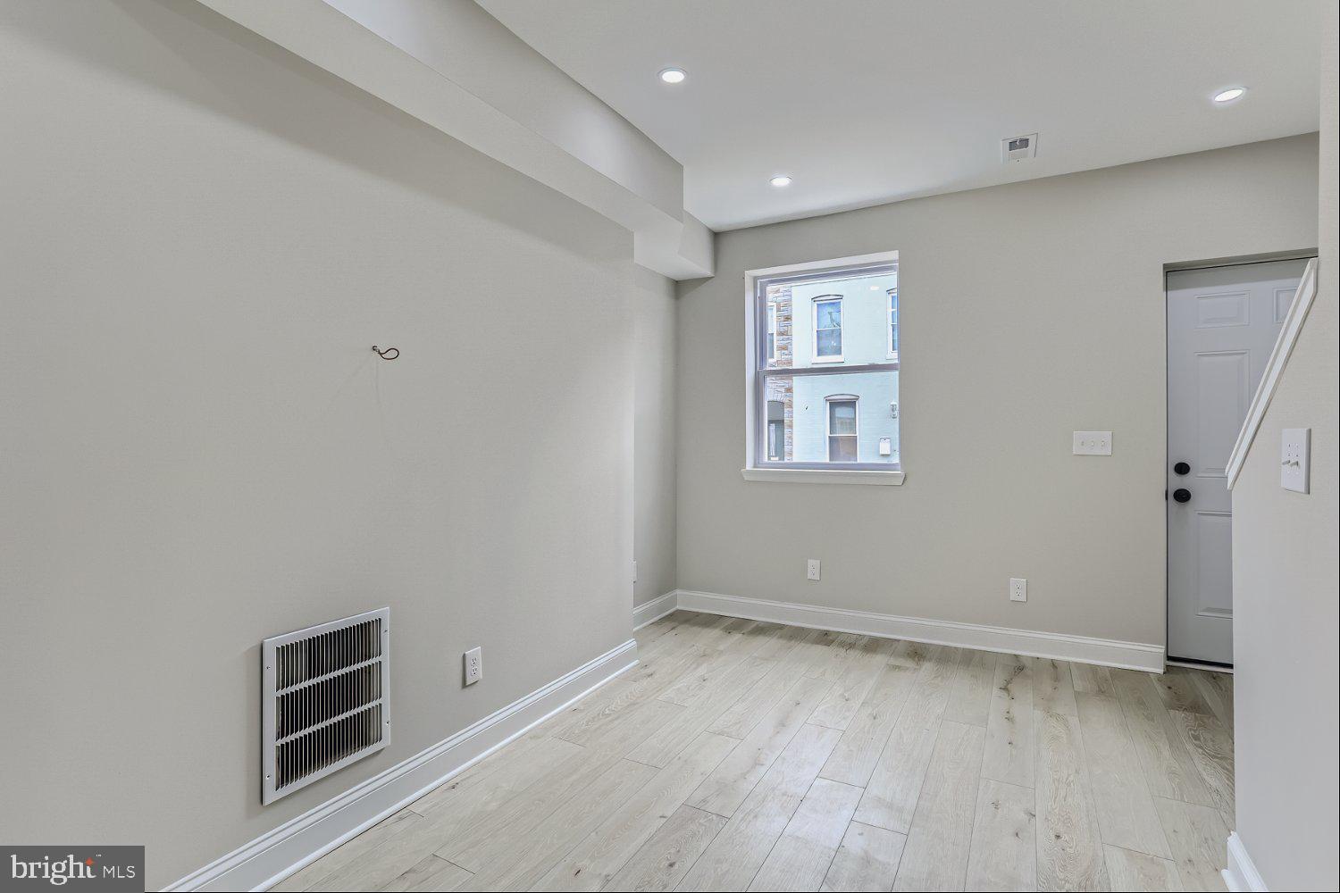 2829 Miles Avenue Baltimore, MD 21211 - Photo 6 of 25 a view of an empty room with a window