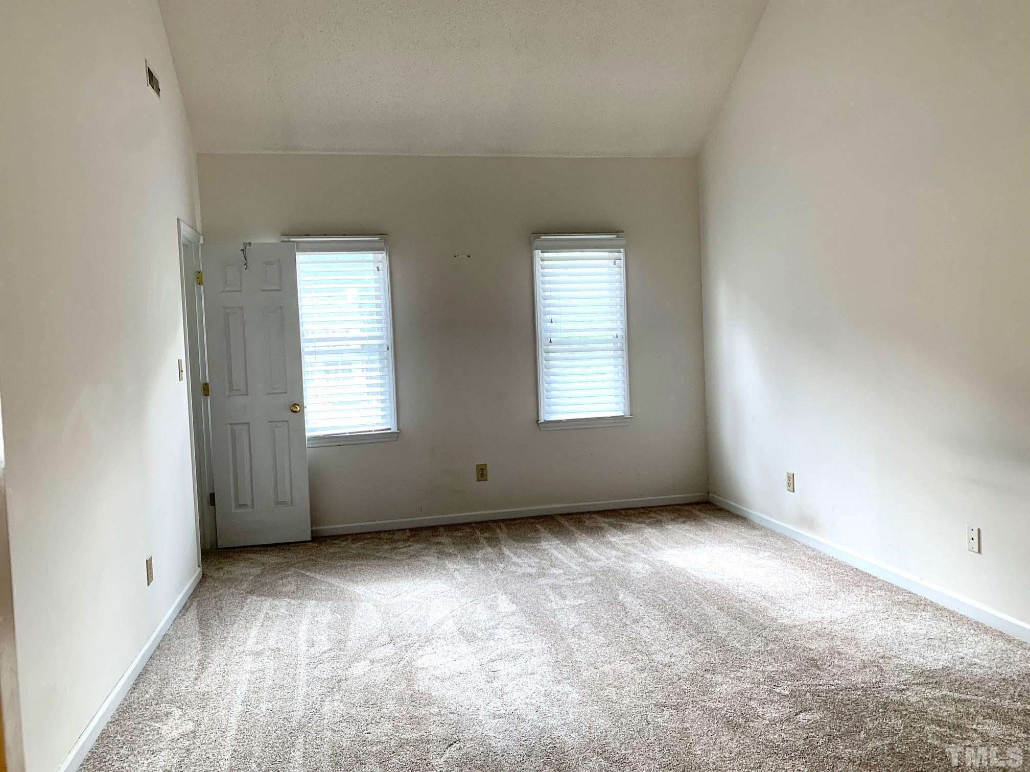 2240 Long And Winding Road Raleigh, NC 27603 - Photo 6 of 10 an empty room with windows