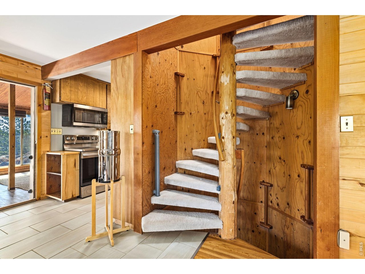 128 Elk Road Lyons, CO 80540 - Photo 15 of 50 spiral staircase up to second bedroom and down to basement workspace