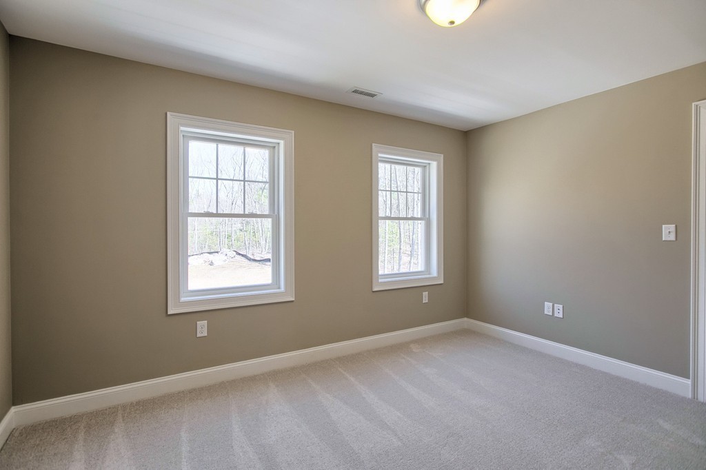 Lot 12 Grapevine Circle Georgetown, MA 01833 - Photo 13 of 27 an empty room with windows
